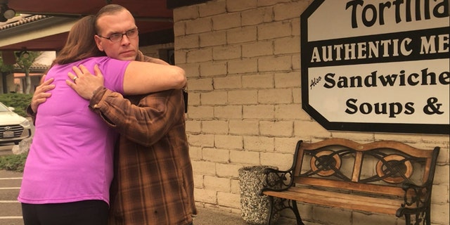 James Welch, seen here embracing his manager at their restaurant, described his grandmother's death as "such a tragedy."