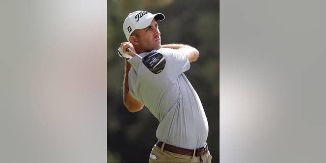 FILE - In this Thursday, June 12, 2014 file photo, Geoff Ogilvy, of Australia, watches his tee shot on the second hole during the first round of the U.S. Open golf tournament in Pinehurst, N.C. The opening tee shot for the first PGA Tour event of the year provides a splendid reminder of the perks for winning. Few players can appreciate it like Geoff Ogilvy. He was the two-time defending champion at the Hyundai Tournament of Champions in 2011 and quickly was becoming a regular as he piled up seven wins over a six-year period. (AP Photo/Chuck Burton, File)