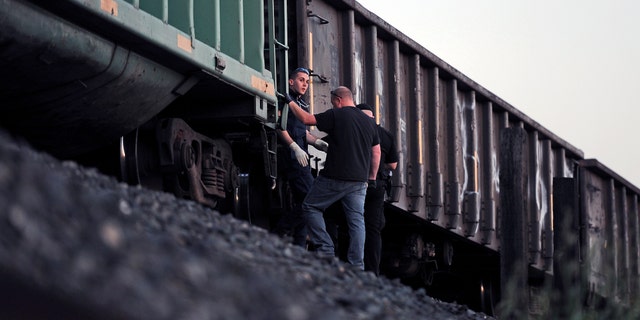 March 21, 2014: Emergency personnel work at the scene of a train accident where two pedestrians were hit near Earle Yorton Field in Marysville, Calif.