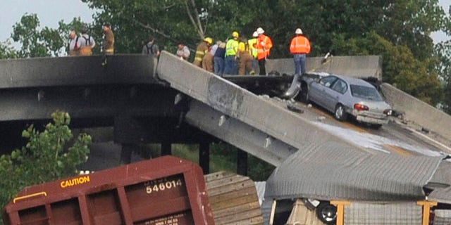 May 25, 2013: Emergency personnel respond to the scene of a train derailment near Rockview, Mo.