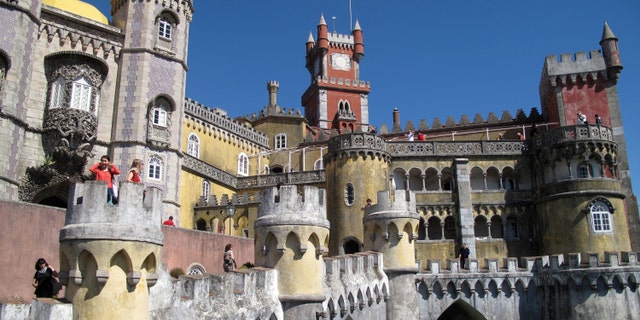 The exterior of Pena Palace in Sintra, Portugal. It's like a castle seen through a kaleidoscope, one of a number of spectacular buildings found in Sintra.