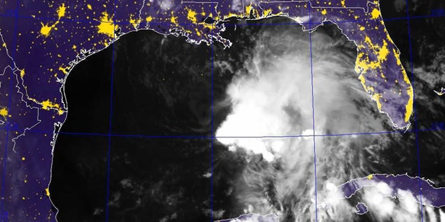 This image provided by the Naval Research Laboratory shows a infrared satellite image taken at 7:40 p.m. EDT Friday Oct. 4, 2013 of Tropical Storm Karen. Karen continued losing strength Saturday as it headed toward the central Gulf Coast, but forecasters were still expecting it to bring significant rain and potential flooding to low-lying areas. The National Hurricane Center reported at 2 a.m. Saturday that Karen's maximum sustained winds had dropped to 40 mph, making it a weak tropical storm. The storm was moving west-northwest at 10 mph to 15 mph. Forecasters say there is a slight chance of strengthening before making landfall. (AP Photo/Naval Research Laboratory)