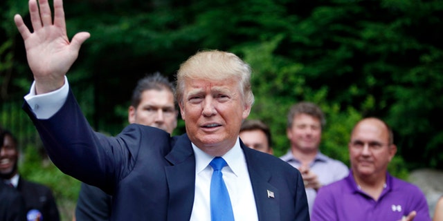 FILE - In this Tuesday, June 30, 2015 file photo, Republican presidential candidate Donald Trump waves as he arrives at a house party in Bedford, N.H. Alex Nogales, president of the National Hispanic Media Coalition, said Thursday, July 9, 2015, that more organizations need to follow the example of NBC and cut business ties with Trump. (AP Photo/Jim Cole, File)