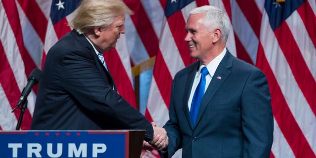 Republican presidential candidate Donald Trump, right, introduces Gov. Mike Pence, R-Ind., during a campaign event to announce Pence as the vice presidential running mate on, Saturday, July 16, 2016, in New York. (AP Photo/Evan Vucci)