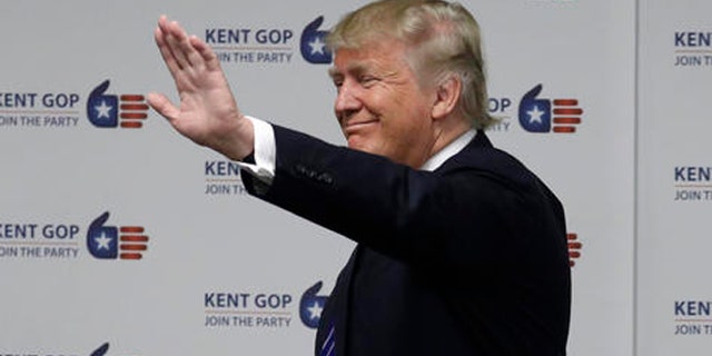 Republican presidential candidate Donald Trump visits the Kent County Republican Headquarters, Friday, Sept. 30, 2016, in Grand Rapids, Mich. (AP Photo/John Locher)