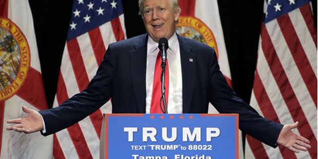 File- This June 11, 2016 file photo shows Republican presidential candidate Donald Trump gesturing during a campaign speech in Tampa, Fla. Trump plans Monday to further address the deadliest shooting in modern U.S. history in a campaign speech originally intended to attack the presumptive Democratic nominee, Hillary Clinton. The switch comes a day after Trump called for Clinton to drop out of the race for president if she didnt use the words radical Islam to describe the Florida nightclub massacre. (AP Photo/Chris O'Meara, File)