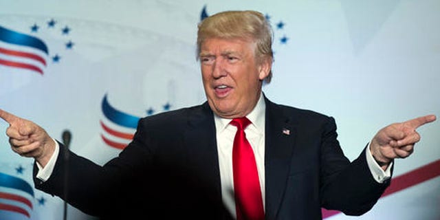 Republican presidential candidate Donald Trump points to the audience after addressing the Faith and Freedom Coalition's Road to Majority Conference in Washington, Friday, June 10, 2016. (AP Photo/Cliff Owen)