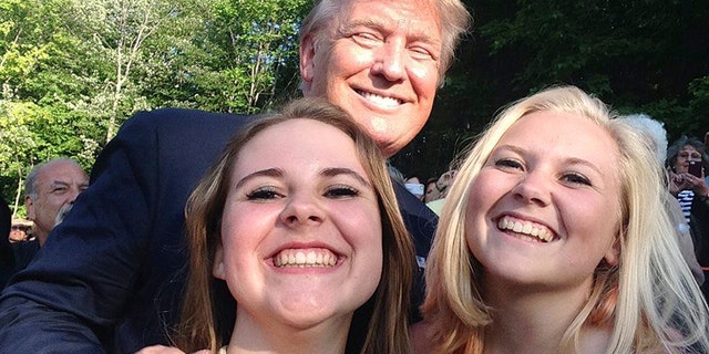 President Trump posed for a photo with Emma Nozell, left, and her sister Addy Nozell in Laconia, N.H. in July 2015. They snagged selfies with every candidate in the 2016 presidential campaign. Now, their mom, Wendy Thomas, is running her own campaign for state office in New Hampshire.