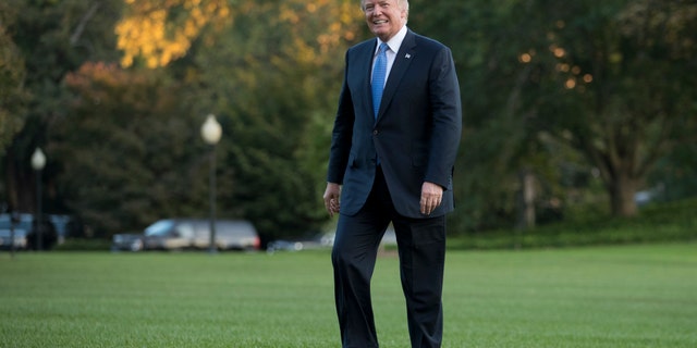 President Donald Trump walks from Marine One across the South Lawn of the White House in Washington, Wednesday, Sept. 27, 2017, as he returns from Indianapolis. (AP Photo/Carolyn Kaster)