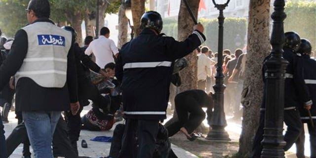 May 5: Tunisian police officers disperse hundreds of demonstrators during clashes in Tunis. The protesters complained Tunisia's new caretaker government has not followed through with the people's revolutionary aspirations. (AP)