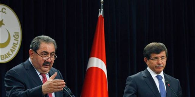 October 13: Iraqi Foreign Minister Hoshyar Zebari, left, and his Turkish counterpart Ahmet Davutoglu speak to the media after their talks in Ankara, Turkey.