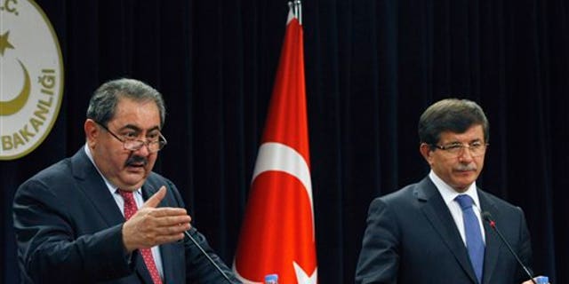 October 13: Iraqi Foreign Minister Hoshyar Zebari, left, and his Turkish counterpart Ahmet Davutoglu speak to the media after their talks in Ankara, Turkey.