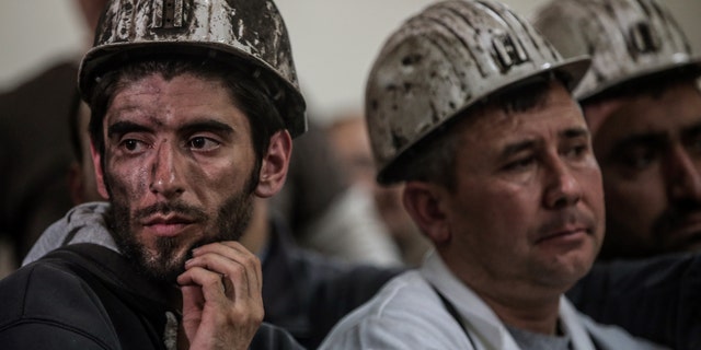 May 16, 2014 - Turkish miners listen to the mining company's owner, Alp Gurkan, during a news conference in Soma, Turkey. The Turkish mining company defended its safety record, 4 days after more than 284 people died in an underground blaze at its coal mine in western Turkey.