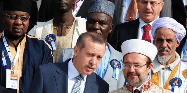 November 21: Turkish Prime Minister Recep Tayyip Erdogan, front left, speaks with Mehmet Gormez, head of Turkey's Religious Affairs Directorate, after a meeting with African Muslim religious leaders in Istanbul, Turkey.