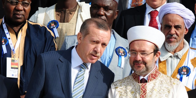 November 21: Turkish Prime Minister Recep Tayyip Erdogan, front left, speaks with Mehmet Gormez, head of Turkey's Religious Affairs Directorate, after a meeting with African Muslim religious leaders in Istanbul, Turkey.