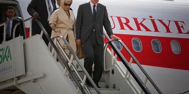 August 19: Turkish Prime Minister Recep Tayyip Erdogan and his wife Emine Erdogan disembark from their plane at Aden Abdulle International Airport on their first official visit to Somalia.