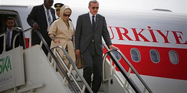 August 19: Turkish Prime Minister Recep Tayyip Erdogan and his wife Emine Erdogan disembark from their plane at Aden Abdulle International Airport on their first official visit to Somalia.