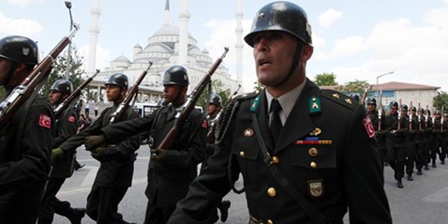 In this July 24, 2010 file photo, Turkish soldiers march after a funeral ceremony.