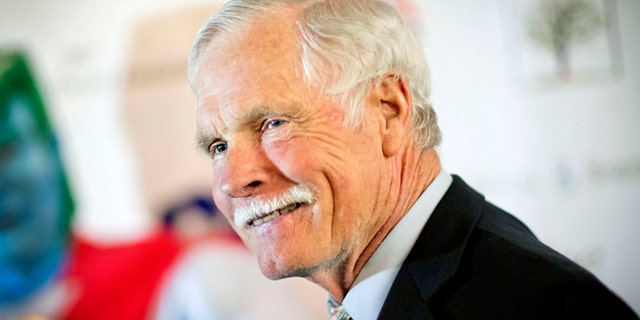 FILE - In this Friday, Dec. 6, 2013 file photo, American media mogul Ted Turner is photographed on the red carpet at the Captain Planet Foundation benefit gala in Atlanta. Turner Enterprises spokesman Phillip Evans in Atlanta said the CNN founder was hospitalized in South America and that "no further details will be provided." CNN's news desk, tweeted that Turner was "under observation" Friday, March 7, 2014, at a hospital in Buenos Aires. (AP Photo/David Goldman, File)