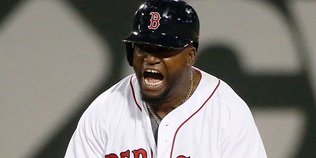 Boston Red Sox's David Ortiz reacts after hitting an RBI double during the seventh inning of a baseball game against the Minnesota Twins in Boston, Saturday, July 23, 2016. (AP Photo/Michael Dwyer)