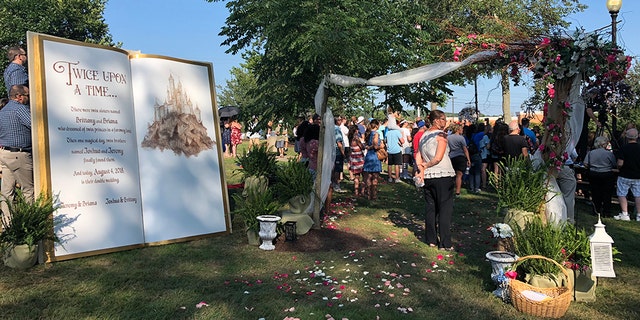 Guests were seriously seeing double, as the outdoor ceremony was officiated by identical twin ministers, as well.
