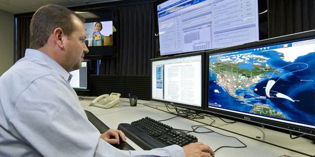 Sept. 29, 2011: A cyber security analyst works in the "watch and warning center" during the first tour of the government’s secretive cyber defense lab.