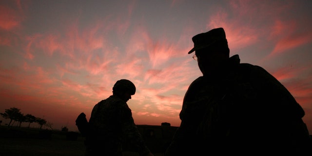 In this Jan. 25, 2007 file photo, the sun sets at a US military base Camp Liberty in Baghdad, Iraq.