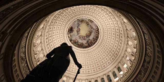 The rotunda of the U.S. Capitol is seen, Friday evening, Feb. 18, 2011, as Republicans and Democrats square off over a spending bill in the House of Representatives with votes and activity scheduled throughout the night on Capitol Hill in Washington. (AP Photo/J. Scott Applewhite)