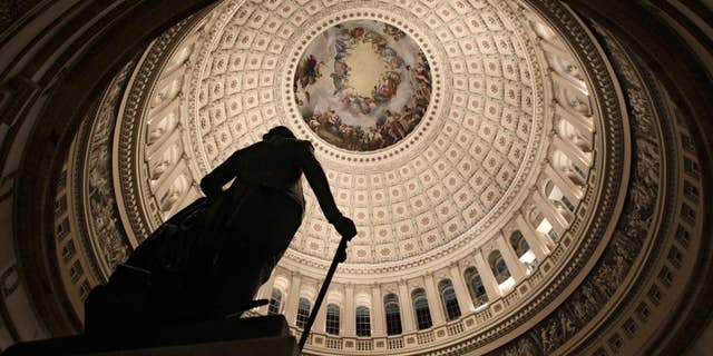 The rotunda of the U.S. Capitol is seen, Friday evening, Feb. 18, 2011, as Republicans and Democrats square off over a spending bill in the House of Representatives with votes and activity scheduled throughout the night on Capitol Hill in Washington. (AP Photo/J. Scott Applewhite)