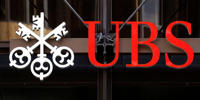 A logo for Swiss bank UBS is seen outside one of their offices in the City of London, Thursday, Sept. 15, 2011. Swiss banking giant UBS said Thursday that a rogue trader has caused it an estimated loss of $2 billion, stunning a beleaguered banking industry that has proven vulnerable to unauthorized trades.