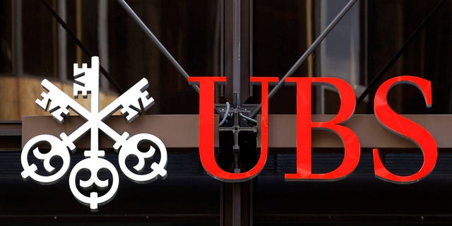 A logo for Swiss bank UBS is seen outside one of their offices in the City of London, Thursday, Sept. 15, 2011. Swiss banking giant UBS said Thursday that a rogue trader has caused it an estimated loss of $2 billion, stunning a beleaguered banking industry that has proven vulnerable to unauthorized trades.