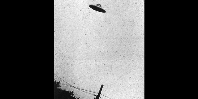 This grainy black and white image purports to show a UFO hovering over Passoria, New Jersey, in July, 1952.