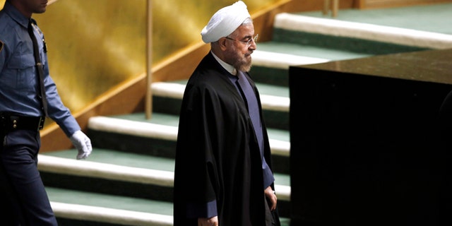 In this Thursday, Sept. 25, 2014 photo, President Hassan Rouhani of Iran walks in before addressing the 69th session of the United Nations General Assembly at U.N. headquarters.