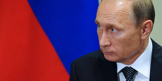 Russian President President Vladimir Putin listens to United Nations Secretary-General Ban Ki-moon after the 70th session of the United Nations General Assembly at U.N. headquarters, New York, Monday, Sept. 28, 2015. (Mikhail Klimentyev, RIA-Novosti, Kremlin Pool Photo via AP)