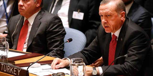 President Recep Tayyib Erdogan of Turkey addresses a meeting of the United Nations Security Council regarding the threat of foreign terrorist fighters during the 69th session of the U.N. General Assembly at U.N. headquarters, Wednesday, Sept. 24, 2014. (AP Photo/Jason DeCrow)