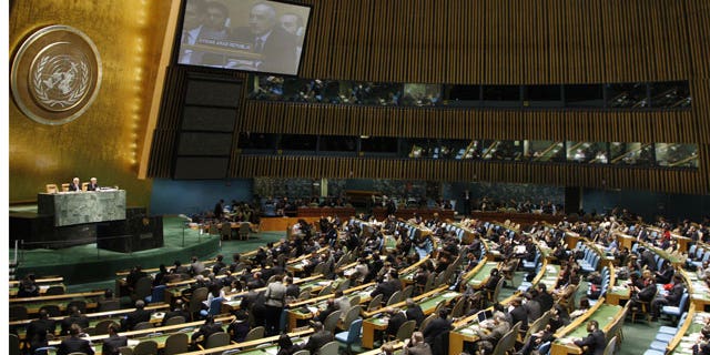 Feb. 16, 2012: In this photo provided by the United Nations, Syrian Ambassador to the United Nations Bashar Ja'afari can be seen on the monitor as he addresses the U. N. General Assembly.