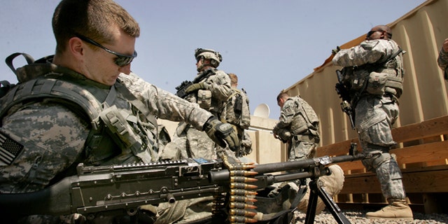 BAGHDAD, IRAQ - MARCH 5: U.S soldiers rest at their base on March 5, 2009 in Baghdad, Iraq. A group of U.S soldiers attended the reopening of the al-Fadael elementary school today in the Al-Hurriya district north of Baghdad after it was repaired from damages suffered during the war. U.S President Barack Obama announced last week plans to leave around 35,000 to 50,000 U.S. military forces in Iraq after pulling the majority of them out by August 2010. (Photo by Wathiq Khuzaie/Getty Images)