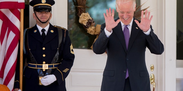 Oct. 15, 2015: Vice President Joe Biden reacts to questions about his potential run for president by members of the media as he waits for South Korean President Park Geun-hye to arrive for lunch at the Naval Observatory in Washington. (AP Photo/Andrew Harnik)