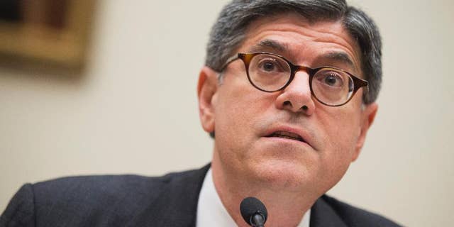 FILE - In this May 8, 2014 file photo, U.S. Treasury Secretary Jacob Lew, testifies before a House Financial Committee hearing on "the annual testimony of the Secretary of the Treasury on the state of the international financial system," on Capitol Hill in Washington. Lew pressed China on Tuesday, May 13, 2014, to ease politically sensitive exchange rate controls and lower barriers to foreign investment. Beijing in March widened the narrow band in which it allows its yuan to fluctuate against the U.S. dollar. But it retained controls that critics complain keep the yuan undervalued and give its exporters an unfair price advantage. (AP Photo/Manuel Balce Ceneta, File)