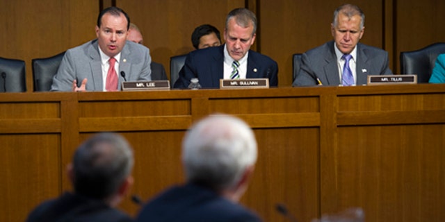 Sept. 17, 2015: Adm. Harry Harris, Jr., US Navy Commander, U.S. Pacific Command and Assistant Defense Secretary for Asian and Pacific Security Affairs David Shear, foreground, are questioned on Capitol Hill in Washington by Senate Armed Services Committee member Sen. Mike Lee, R-Utah, left, as members Sen. Daniel Sullivan, R-Alaska, center, and Sen. Thom Tillis, R-N.C., right, listen during the committee's hearing on maritime security strategy in the Asia-Pacific region. (AP Photo/Cliff Owen)