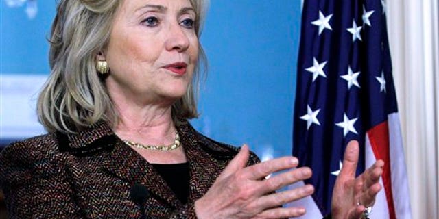June 2: Secretary of State Hillary Rodham Clinton, accompanied by Czech Foreign Minister Karel Schwarzberg, not shown gestures during their joint news confernece at the State Department in Washington. (AP)