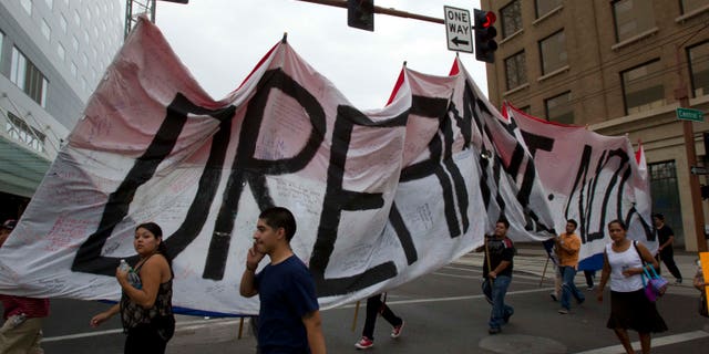 Aug. 15, 2012: Student protestors walk towards the Arizona Capitol in Phoenix after Gov. Jan Brewer issued an executive order.
