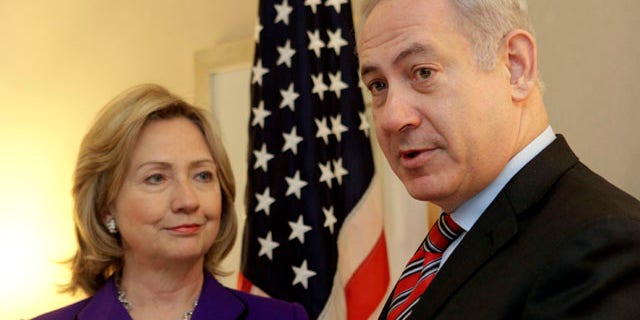 Nov. 11: U.S. Secretary of State Hillary Rodham Clinton, left, listens as Israeli Prime Minister Benjamin Netanyahu speaks to reporters during a meeting in New York.
