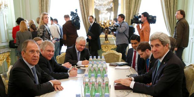 Secretary of State John Kerry and Russian Foreign Minister Sergei Lavrov meet at the Russian Ambassador's Residence in Paris, Wednesday, March 5, 2014. Russia rebuffed Western demands to withdraw forces in Ukraine's Crimea region to their bases on Wednesday amid a day of high-stakes diplomacy in Paris aimed at easing tensions over Ukraine and averting the risk of war. (AP Photo/Kevin Lamarque, Pool)