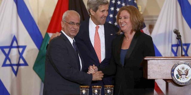 July 30, 2013: Secretary of State John Kerry stands with Israel's Justice Minister and chief negotiator Tzipi Livni, right, and Palestinian chief negotiator Saeb Erekat, after the resumption of Israeli-Palestinian peace talks at the State Department in Washington. (AP Photo)