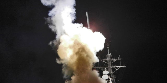 March 19: Arleigh Burke-class guided-missile destroyer USS Barry launches a Tomahawk missile in support of Operation Odyssey Dawn. This was one of approximately 110 cruise missiles fired from U.S. and British ships and submarines that targeted about 20 radar and anti-aircraft sites along Libya's Mediterranean coast. (U.S. Navy)