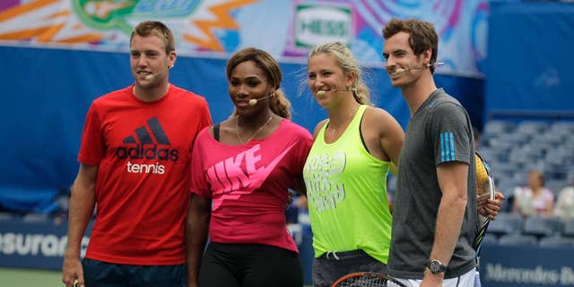 Tennis players, from left, Jack Sock, Serena Williams, Victoria Azarenka and Andy Murray appear at U.S. Open Arthur Ashe Kids Day at the USTA Billie Jean King National Tennis Center on Saturday, Aug. 23, 2014, in New York. (Photo by Andy Kropa/Invision/AP)