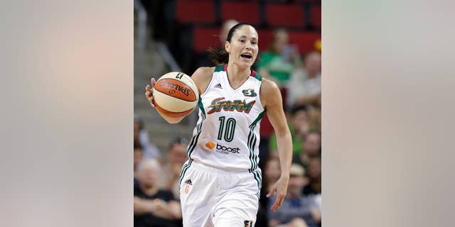 FILE - In this Thursday, July 31, 2014 file photo, Seattle Storm's Sue Bird plays against the Indiana Fever in a WNBA basketball game in Seattle. Bird became the first American player to make four world championship teams when USA Basketball announced the roster on Tuesday, Sept. 23, 2014. Bird won gold medals in 2002 and 2010 and a bronze medal in 2006. (AP Photo/Elaine Thompson, File)