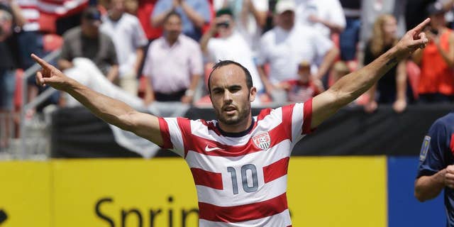 FILE - In this July 13, 2013, file photo, United States' Landon Donovan gestures after scoring on a penalty kick during the first half of a CONCACAF Gold Cup soccer game against Cuba in Sandy, Utah. Donovan will be surrounded by a relatively youthful roster for the United States' exhibition against Ecuador in Connecticut on Friday, when he is set to make his 157th and final international appearance. (AP Photo/Rick Bowmer, File)