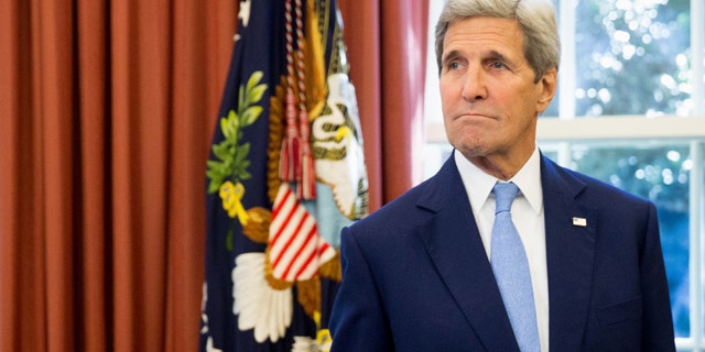 FILE - In this Sept. 15, 2015 file photo, Secretary of State John Kerry is seen in the Oval Office of the White House in Washington. (AP Photo/Andrew Harnik, File)
